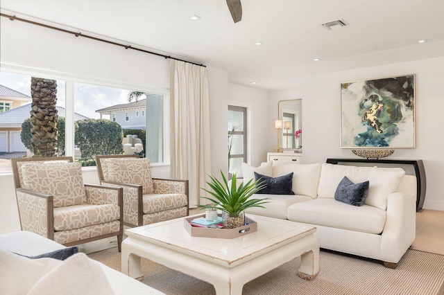 living area with visible vents and recessed lighting