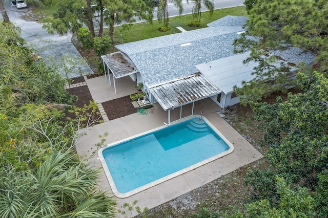 pool with a patio area