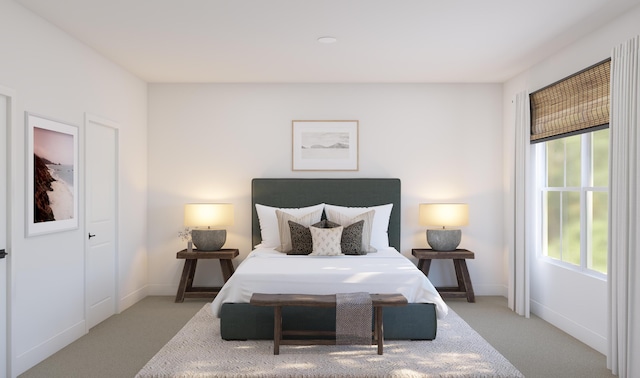 bedroom featuring baseboards, multiple windows, and light colored carpet