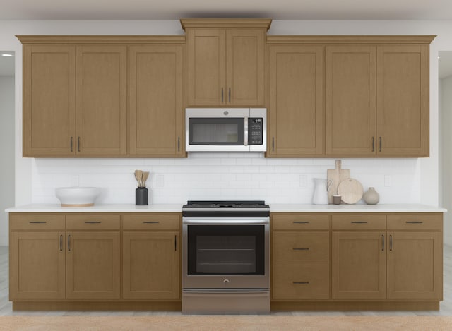 kitchen with backsplash, stainless steel appliances, and light countertops