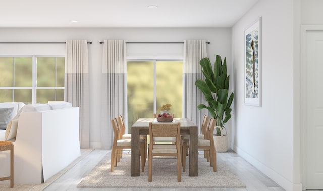 dining space featuring recessed lighting, baseboards, and light wood-type flooring