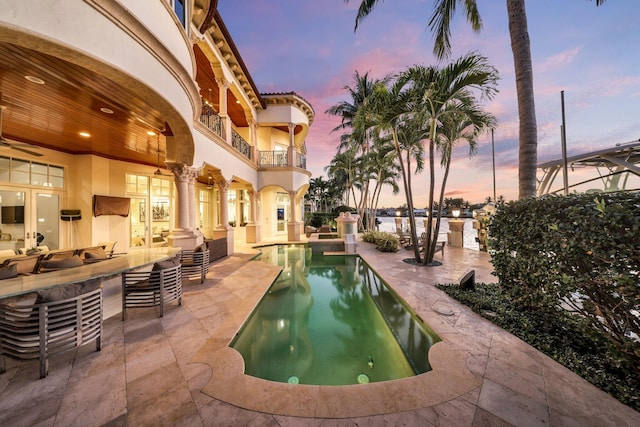4216 Intracoastal Dr, Highland Beach, FL 33487 - pool at dusk with a patio, an outdoor pool, and french doors