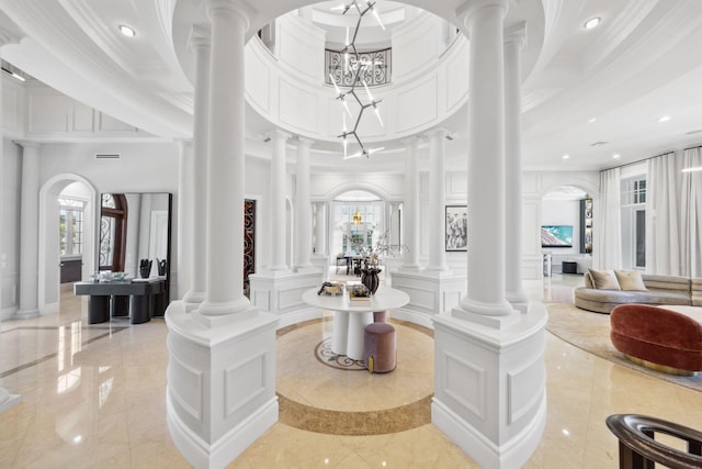4216 Intracoastal Dr, Highland Beach, FL 33487 - community lobby with crown molding, recessed lighting, a towering ceiling, and a decorative wall