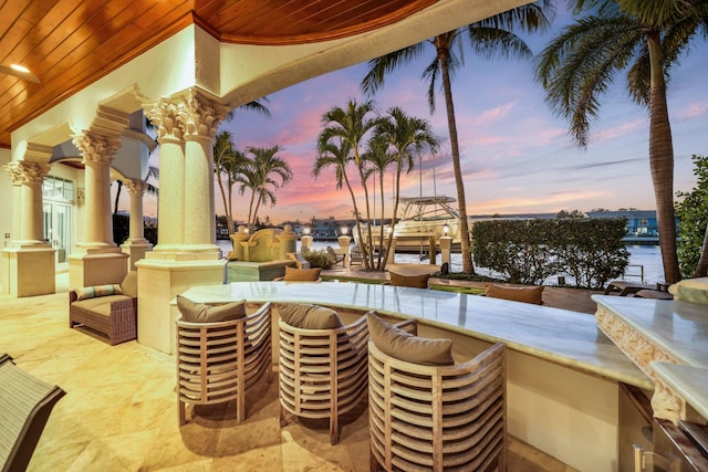 4216 Intracoastal Dr, Highland Beach, FL 33487 - patio terrace at dusk featuring boat lift and a dock