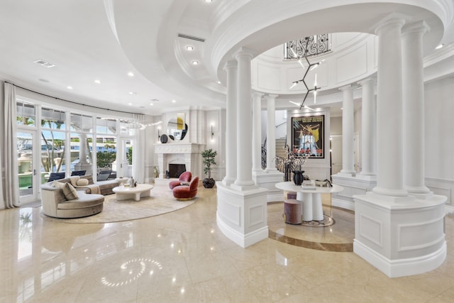 4216 Intracoastal Dr, Highland Beach, FL 33487 - entryway featuring ornate columns, a decorative wall, ornamental molding, recessed lighting, and a towering ceiling