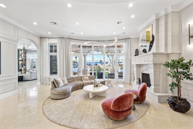 4216 Intracoastal Dr, Highland Beach, FL 33487 - living area with crown molding, recessed lighting, ornate columns, a decorative wall, and a premium fireplace