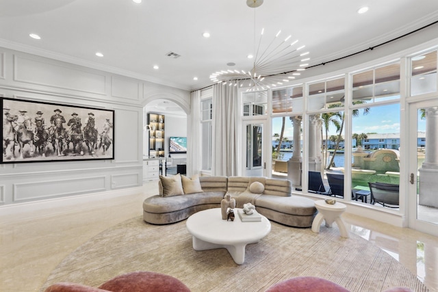 4216 Intracoastal Dr, Highland Beach, FL 33487 - living room featuring crown molding, a decorative wall, recessed lighting, a water view, and arched walkways
