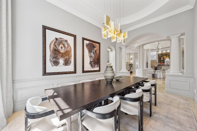 4216 Intracoastal Dr, Highland Beach, FL 33487 - dining room with ornate columns, a decorative wall, ornamental molding, arched walkways, and a chandelier