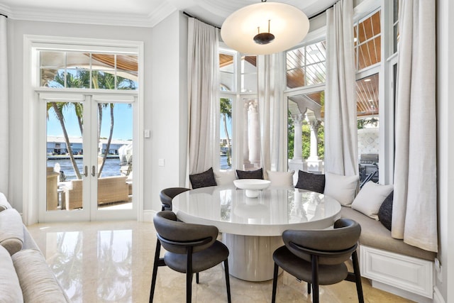 4216 Intracoastal Dr, Highland Beach, FL 33487 - dining space with a water view, healthy amount of natural light, crown molding, and french doors