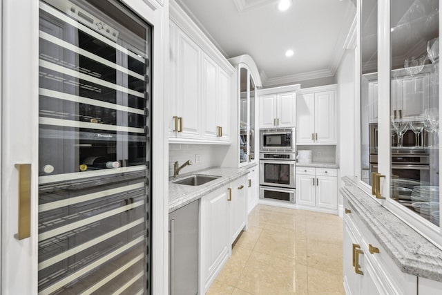 4216 Intracoastal Dr, Highland Beach, FL 33487 - kitchen featuring wine cooler, a sink, white cabinetry, crown molding, and tasteful backsplash