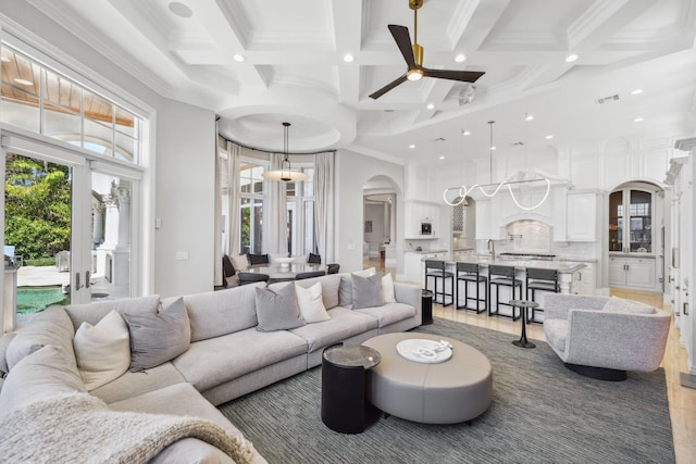 4216 Intracoastal Dr, Highland Beach, FL 33487 - living area with arched walkways, recessed lighting, coffered ceiling, ornamental molding, and ceiling fan