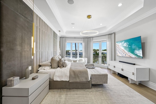 4216 Intracoastal Dr, Highland Beach, FL 33487 - bedroom featuring a tray ceiling, ornamental molding, access to exterior, light wood finished floors, and recessed lighting