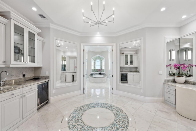 4216 Intracoastal Dr, Highland Beach, FL 33487 - full bathroom with beverage cooler, tasteful backsplash, baseboards, recessed lighting, and ornamental molding