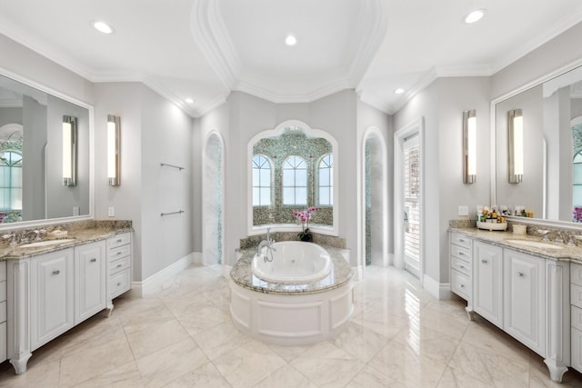 4216 Intracoastal Dr, Highland Beach, FL 33487 - bathroom featuring crown molding, a whirlpool tub, baseboards, two vanities, and marble finish floors
