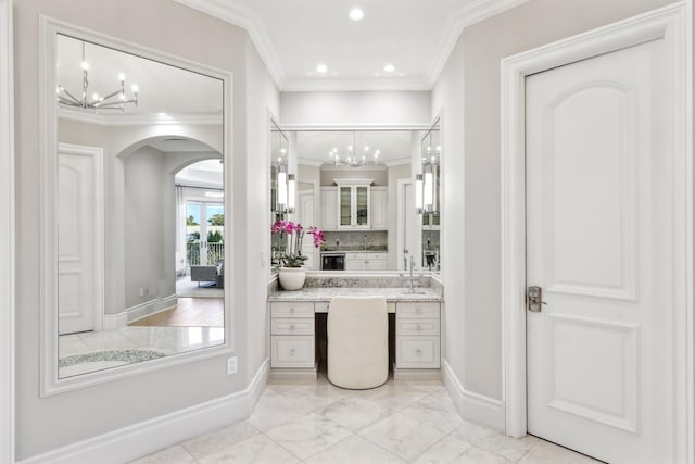 4216 Intracoastal Dr, Highland Beach, FL 33487 - bathroom with a chandelier, ornamental molding, baseboards, vanity, and recessed lighting