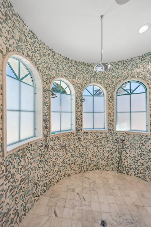 4216 Intracoastal Dr, Highland Beach, FL 33487 - bathroom with healthy amount of natural light, tile walls, and recessed lighting