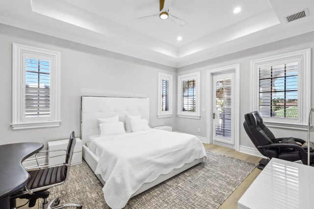 4216 Intracoastal Dr, Highland Beach, FL 33487 - bedroom featuring a tray ceiling, access to exterior, ornamental molding, a desk, and wood finished floors