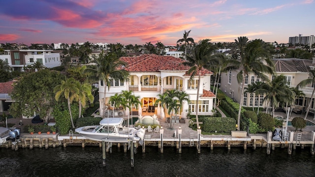 4216 Intracoastal Dr, Highland Beach, FL 33487 - rear view of property with a balcony, a water view, a patio, and boat lift