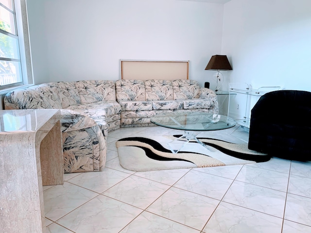 living area featuring marble finish floor