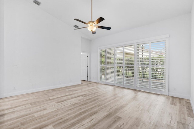 empty room featuring visible vents, baseboards, light wood-style floors, and ceiling fan