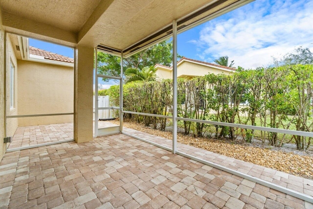 unfurnished sunroom with a healthy amount of sunlight