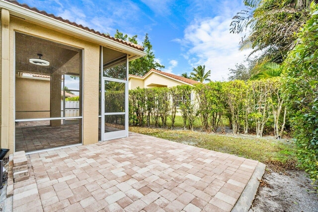 view of patio / terrace with a sunroom