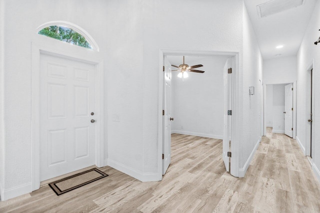 entrance foyer featuring light wood-style flooring and baseboards