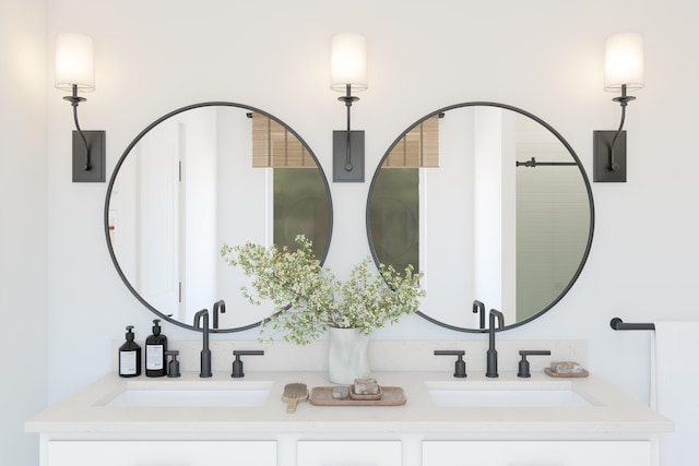 bathroom featuring double vanity and a sink