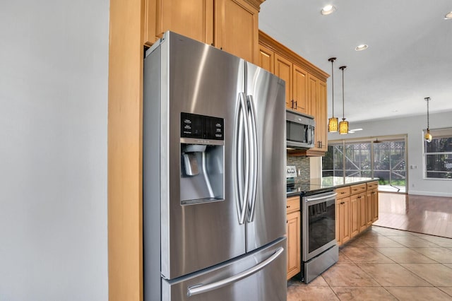 kitchen with tasteful backsplash, pendant lighting, recessed lighting, light tile patterned flooring, and stainless steel appliances