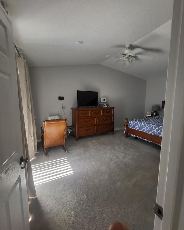 bedroom featuring carpet, a ceiling fan, and vaulted ceiling