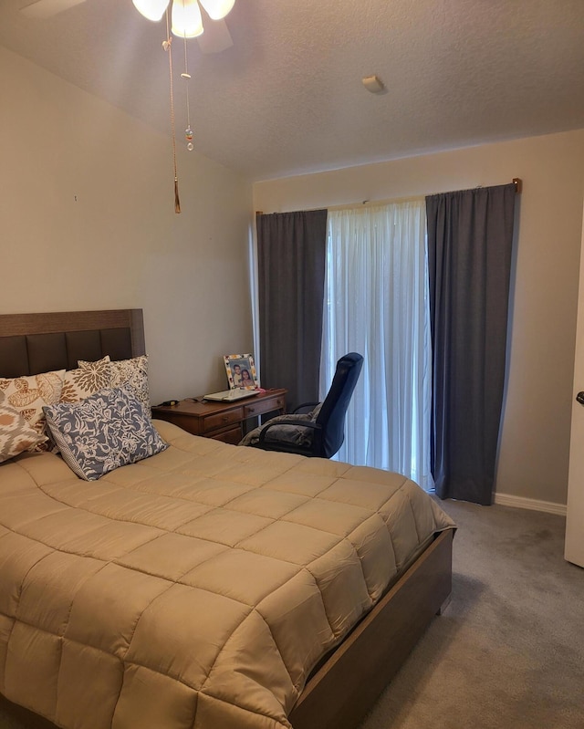 bedroom with baseboards, ceiling fan, a textured ceiling, and carpet