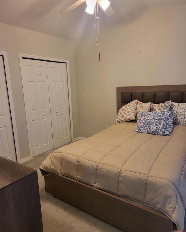 carpeted bedroom with baseboards and ceiling fan