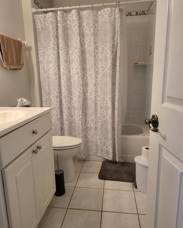 bathroom featuring toilet, shower / bath combination with curtain, vanity, and tile patterned flooring