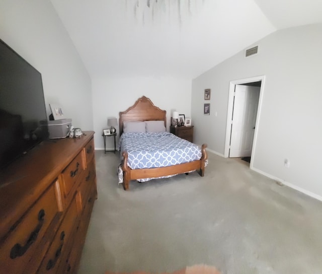 bedroom featuring vaulted ceiling, light colored carpet, visible vents, and baseboards