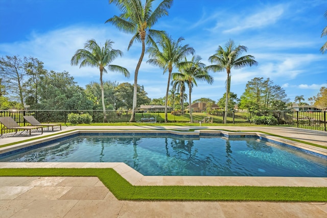 view of swimming pool with a patio area, fence, and a fenced in pool