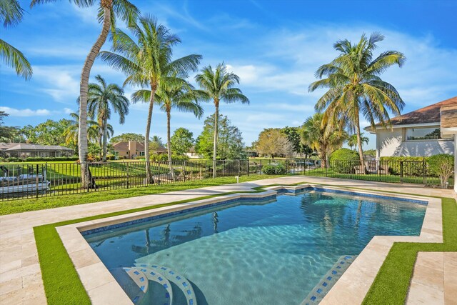 view of swimming pool with a fenced in pool and fence