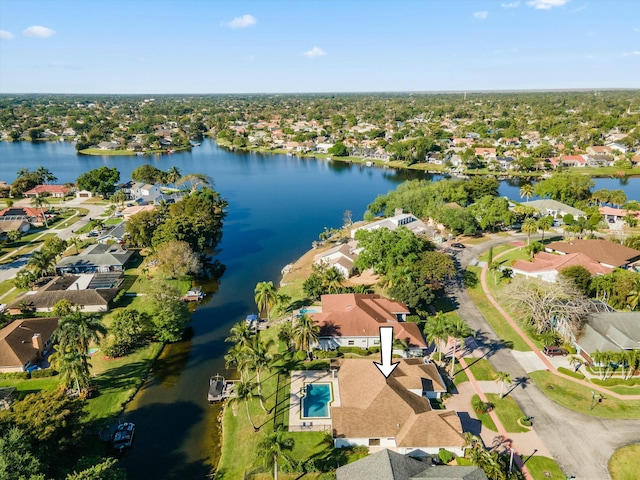 drone / aerial view with a residential view and a water view