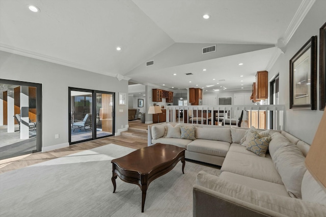 living room with visible vents, light wood-style flooring, recessed lighting, crown molding, and lofted ceiling