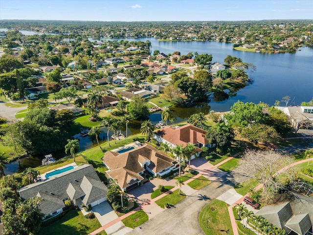 birds eye view of property featuring a residential view and a water view