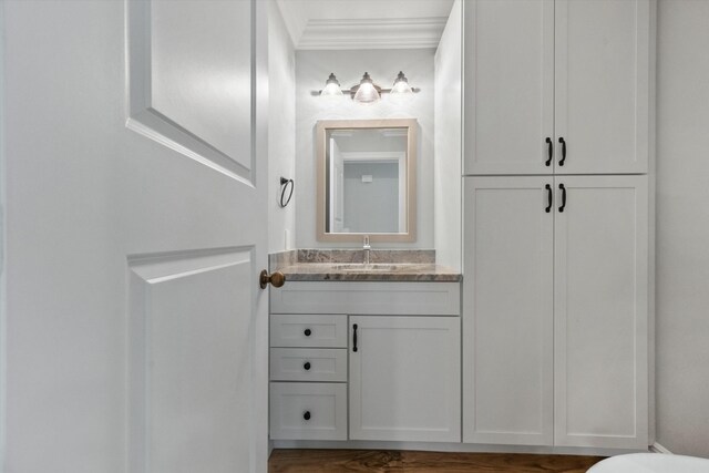 bathroom with vanity and crown molding