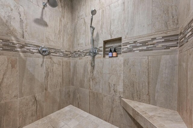 full bathroom featuring a tile shower