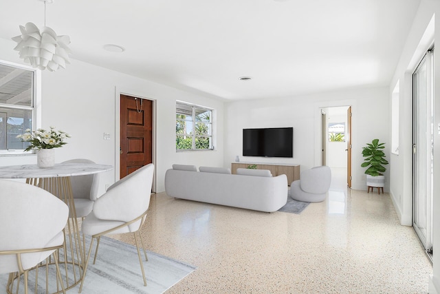 living area with speckled floor