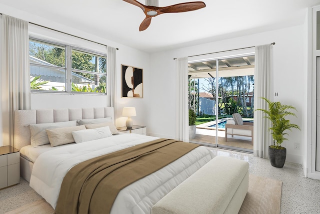 bedroom with baseboards, light speckled floor, ceiling fan, and access to outside