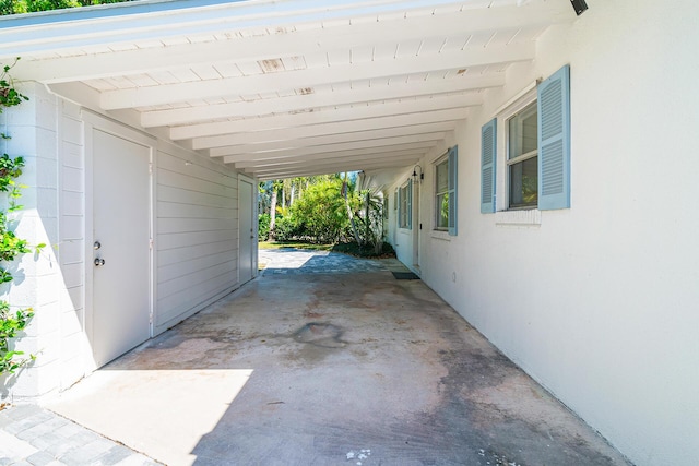 view of patio featuring a carport and driveway