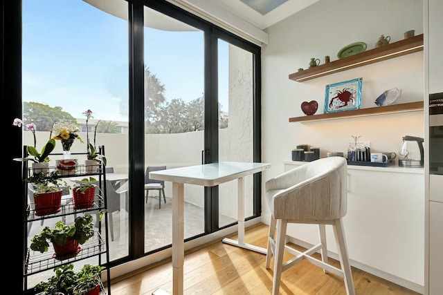 dining space with light wood-type flooring