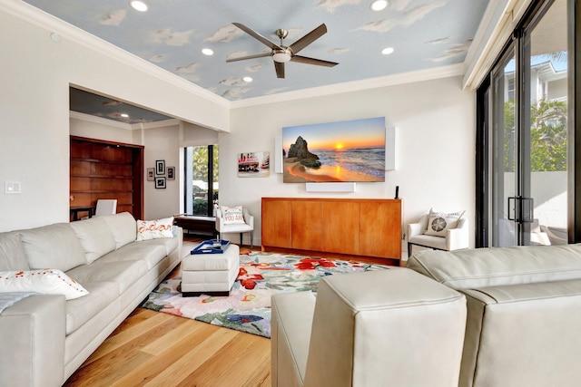 living room featuring recessed lighting, wood finished floors, a ceiling fan, and ornamental molding