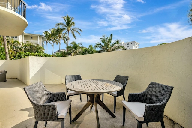 view of patio / terrace featuring outdoor dining space and a balcony