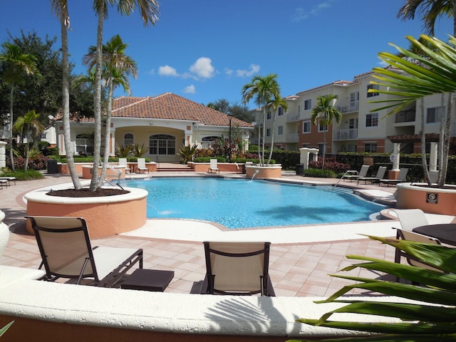 community pool featuring a patio