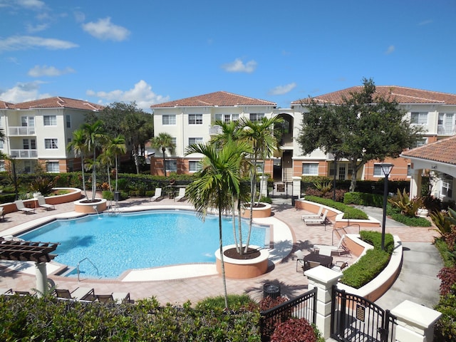 pool featuring a patio and fence