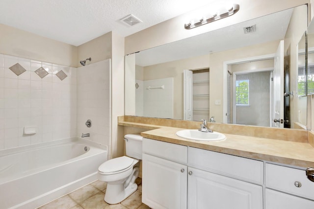 bathroom featuring tile patterned flooring, visible vents, a textured ceiling, and toilet